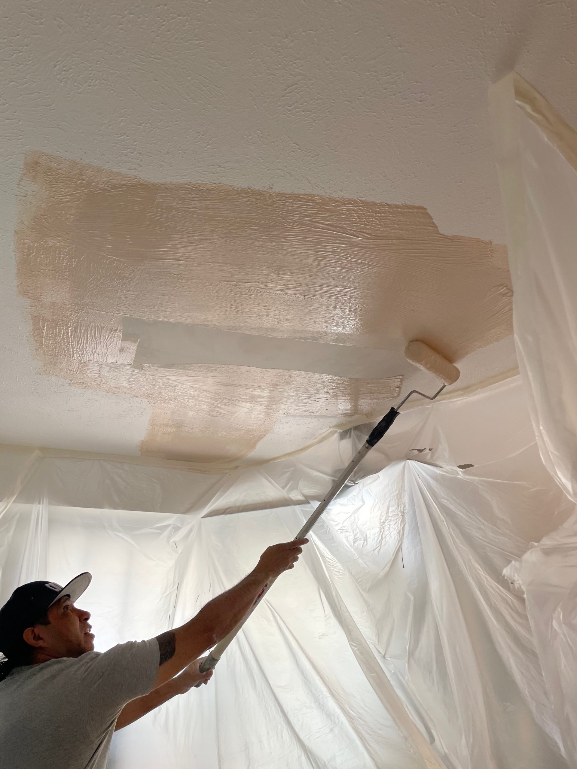 Man repairing hole in Drywall